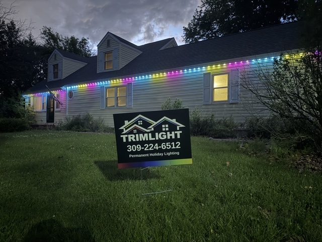 Home roofline lit in full-color rainbow